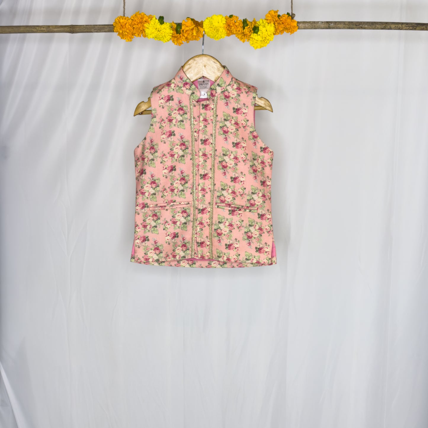 Adhiraaj- a peach floral jacket kurta set
